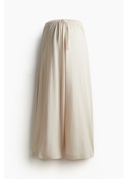 H & M - MAMA Spodnie o luźnym kroju - Beżowy ze sklepu H&M w kategorii Spodnie damskie - zdjęcie 173134869