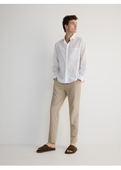 Reserved - Spodnie slim fit - beżowy ze sklepu Reserved w kategorii Spodnie męskie - zdjęcie 173297475