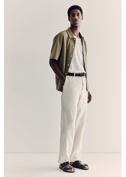 H & M - Lniane spodnie Regular Fit - Beżowy ze sklepu H&M w kategorii Spodnie męskie - zdjęcie 173372216