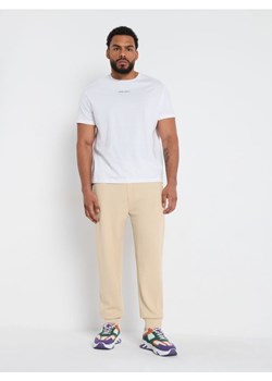 Sinsay - Spodnie dresowe - kremowy ze sklepu Sinsay w kategorii Spodnie męskie - zdjęcie 173391108