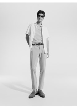 Reserved - Spodnie slim fit - beżowy ze sklepu Reserved w kategorii Spodnie męskie - zdjęcie 173412088