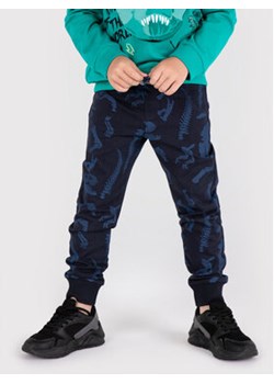 Coccodrillo Spodnie dresowe ZC1122701DIN Granatowy Regular Fit ze sklepu MODIVO w kategorii Spodnie chłopięce - zdjęcie 173448995