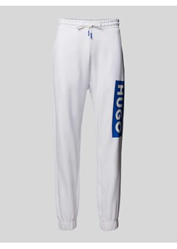 Spodnie dresowe o kroju regular fit z nadrukiem z logo model ‘Nuram’ ze sklepu Peek&Cloppenburg  w kategorii Spodnie męskie - zdjęcie 173459858