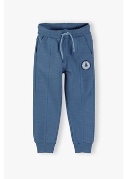 Bawełniane spodnie chłopięce - niebieskie ze sklepu 5.10.15 w kategorii Spodnie chłopięce - zdjęcie 173499509