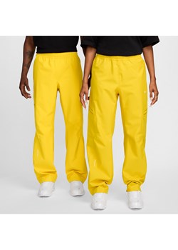 Męskie spodnie techniczne NOCTA x L'ART - Żółty ze sklepu Nike poland w kategorii Spodnie męskie - zdjęcie 173532636