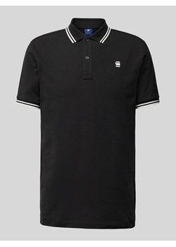 Koszulka polo o kroju slim fit z przedłużonym tyłem model ‘Dunda’ ze sklepu Peek&Cloppenburg  w kategorii T-shirty męskie - zdjęcie 173556417