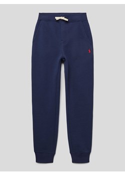 Spodnie dresowe z elastycznym ściągaczem ze sklepu Peek&Cloppenburg  w kategorii Spodnie chłopięce - zdjęcie 173646956