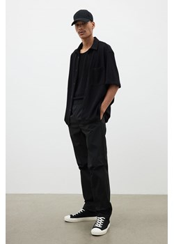 H & M - Nylonowe spodnie Regular Fit - Czarny ze sklepu H&M w kategorii Spodnie męskie - zdjęcie 173647297