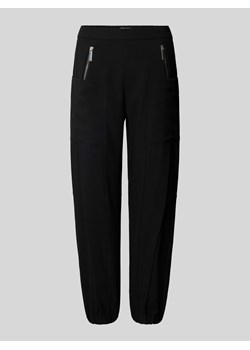 Spodnie materiałowe o kroju tapered fit z elastycznym pasem model ‘Nagano’ ze sklepu Peek&Cloppenburg  w kategorii Spodnie damskie - zdjęcie 173665169