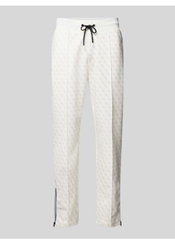 Spodnie dresowe z nadrukiem z logo na całej powierzchni model ‘KORBIN’ ze sklepu Peek&Cloppenburg  w kategorii Spodnie męskie - zdjęcie 173705255