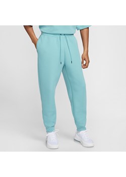 Męskie spodnie z dzianiny Nike Tech - Niebieski ze sklepu Nike poland w kategorii Spodnie męskie - zdjęcie 173816856