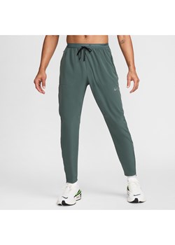 Męskie spodnie do biegania z tkaniny Nike Dri-FIT Phenom - Zieleń ze sklepu Nike poland w kategorii Spodnie męskie - zdjęcie 173852387