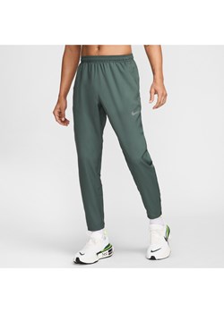 Męskie spodnie do biegania z tkaniny Dri-FIT Nike Challenger - Zieleń ze sklepu Nike poland w kategorii Spodnie męskie - zdjęcie 173852426