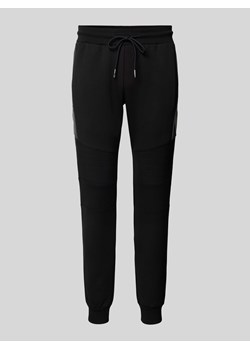 Spodnie dresowe z elastycznym ściągaczem ze sklepu Peek&Cloppenburg  w kategorii Spodnie męskie - zdjęcie 173864299