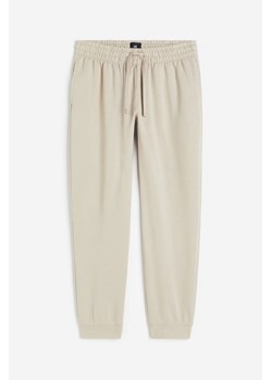 H & M - Spodnie dresowe Regular Fit - Brązowy ze sklepu H&M w kategorii Spodnie damskie - zdjęcie 173969547