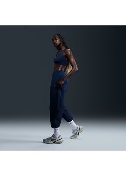 Damskie tkane joggery o kroju oversize ze średnim stanem Nike Sportswear Essential - Niebieski ze sklepu Nike poland w kategorii Spodnie damskie - zdjęcie 173984859