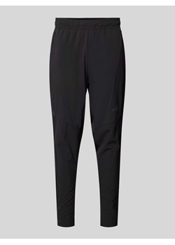 Spodnie dresowe o kroju tapered fit z kieszeniami zapinanymi na zamek błyskawiczny ze sklepu Peek&Cloppenburg  w kategorii Spodnie męskie - zdjęcie 174000179