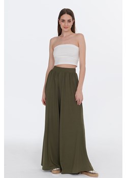 Szerokie spodnie Olive Garden XS/S ze sklepu NAOKO w kategorii Spodnie damskie - zdjęcie 174028658