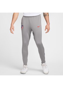 Męskie spodnie piłkarskie Atlético Madryt Strike Nike Dri-FIT - Szary ze sklepu Nike poland w kategorii Spodnie męskie - zdjęcie 174117889