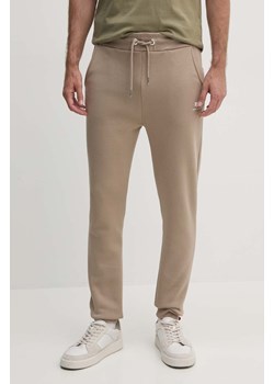 Alpha Industries spodnie dresowe kolor beżowy gładkie ze sklepu PRM w kategorii Spodnie męskie - zdjęcie 174175629