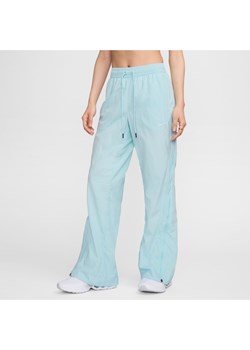 Damskie spodnie ze średnim stanem i zamkiem Repel Nike Sportswear Collection - Niebieski ze sklepu Nike poland w kategorii Spodnie damskie - zdjęcie 174505957