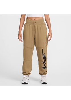 Damskie spodnie z dzianiny dresowej o kroju oversize ze średnim stanem Nike Sportswear Breaking - Brązowy ze sklepu Nike poland w kategorii Spodnie damskie - zdjęcie 174605308