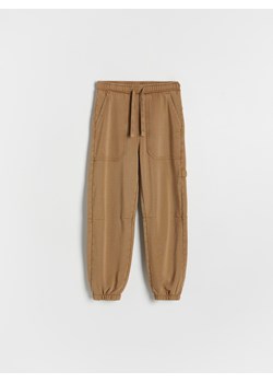 Reserved - Joggery z efektem sprania - brązowy ze sklepu Reserved w kategorii Spodnie chłopięce - zdjęcie 174609568