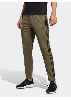 adidas Spodnie sportowe &quot;Essentials&quot; w kolorze khaki ze sklepu Limango Polska w kategorii Spodnie męskie - zdjęcie 175136449