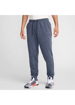 Męskie uniwersalne joggery Dri-FIT UV Nike Primary - Niebieski ze sklepu Nike poland w kategorii Spodnie męskie - zdjęcie 175215698