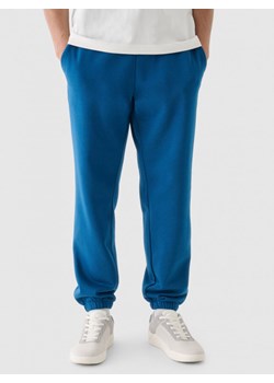 Męskie spodnie dresowe joggery 4F 4FWMM00TTROM1140 - turkusowe ze sklepu Sportstylestory.com w kategorii Spodnie męskie - zdjęcie 175556786