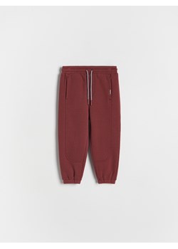 Reserved - Dresowe spodnie jogger - bordowy ze sklepu Reserved w kategorii Spodnie chłopięce - zdjęcie 175593047