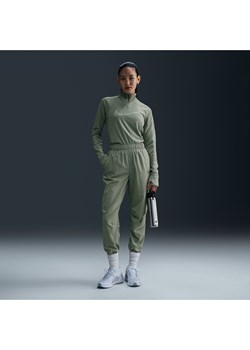 Damskie spodnie do biegania i rozgrzewki 7/8 ze średnim stanem Nike Dri-FIT Fast - Zieleń ze sklepu Nike poland w kategorii Spodnie damskie - zdjęcie 176026826