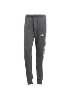 Spodnie męskie adidas Essentials French Terry Tapered Cuff 3-Stripes ze sklepu Decathlon w kategorii Spodnie męskie - zdjęcie 176151495