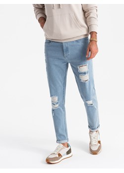 Washowane męskie jeansowe spodnie TAPERED FIT z przetarciami – błękitne V1 OM-PADP-0163 ze sklepu ombre w kategorii Jeansy męskie - zdjęcie 176237665