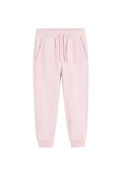COOL CLUB Spodnie dresowe w kolorze jasnoróżowym ze sklepu Limango Polska w kategorii Spodnie dziewczęce - zdjęcie 176400036