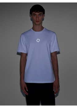 Męski t-shirt z nadrukiem Outhorn OTHWAW24TTSHM2435 - biały ze sklepu Sportstylestory.com w kategorii T-shirty męskie - zdjęcie 176422157