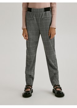 Reserved - Spodnie w kratę - wielobarwny ze sklepu Reserved w kategorii Spodnie dziewczęce - zdjęcie 176599548