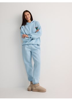 Reserved - Spodnie dresowe z bawełny - jasnoniebieski ze sklepu Reserved w kategorii Spodnie damskie - zdjęcie 176600258