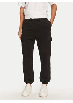 Jack&Jones Spodnie dresowe Kane 12263074 Czarny Relaxed Fit ze sklepu MODIVO w kategorii Spodnie męskie - zdjęcie 176639385