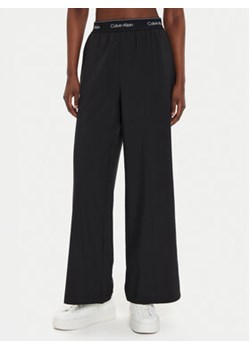 Calvin Klein Performance Spodnie dresowe 00GWF4P606 Czarny Wide Leg ze sklepu MODIVO w kategorii Spodnie damskie - zdjęcie 176735185