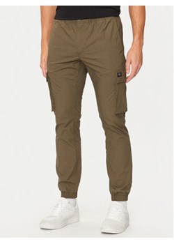 Calvin Klein Jeans Joggery J30J326438 Khaki Skinny Fit ze sklepu MODIVO w kategorii Spodnie męskie - zdjęcie 176772339