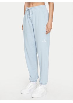 adidas Spodnie dresowe ALL SZN French Terry IY6816 Błękitny Loose Fit ze sklepu MODIVO w kategorii Spodnie damskie - zdjęcie 176996449