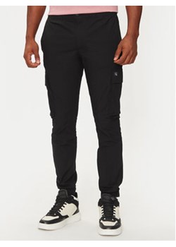 Calvin Klein Jeans Joggery J30J326438 Czarny Skinny Fit ze sklepu MODIVO w kategorii Spodnie męskie - zdjęcie 177006815