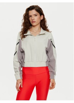 Under Armour Wiatrówka UA Unstoppable Crop 1386479 Écru Regular Fit ze sklepu MODIVO w kategorii Kurtki damskie - zdjęcie 177129467