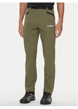 adidas Spodnie outdoor Terrex Xperior IK3533 Khaki Regular Fit ze sklepu MODIVO w kategorii Spodnie męskie - zdjęcie 177145478