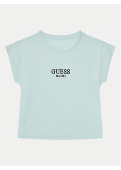 Guess T-Shirt J4BI34 J1314 Błękitny Boxy Fit ze sklepu MODIVO w kategorii Bluzki dziewczęce - zdjęcie 177199398