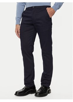 Calvin Klein Chinosy K10K113429 Granatowy Slim Fit ze sklepu MODIVO w kategorii Spodnie męskie - zdjęcie 177238076