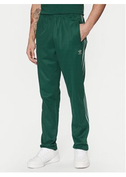 adidas Spodnie dresowe adicolor Classics Beckenbauer JP2523 Zielony Slim Fit ze sklepu MODIVO w kategorii Spodnie męskie - zdjęcie 177606118