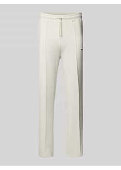 Spodnie typu track pants z elastycznym pasem i wyhaftowanym logo ze sklepu Peek&Cloppenburg  w kategorii Spodnie męskie - zdjęcie 177828866
