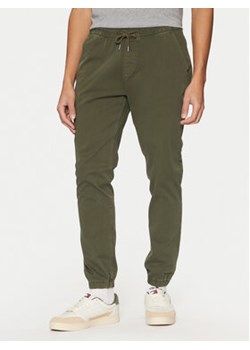 Tommy Jeans Joggery Austin DM0DM20283 Zielony Slim Fit ze sklepu MODIVO w kategorii Spodnie męskie - zdjęcie 177864328